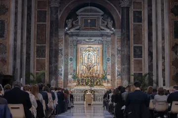 Pope Francis prays the rosary before an icon of Our Lady of Help in St. Peter's Basilica.